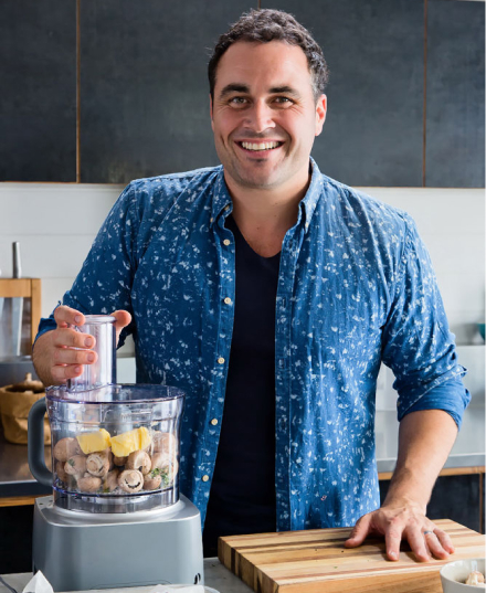 Professional headshot portrait of a chef in situ.