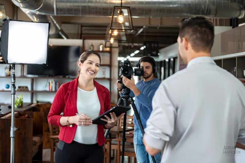 Lady interviewing man for a company explainer or branding video.