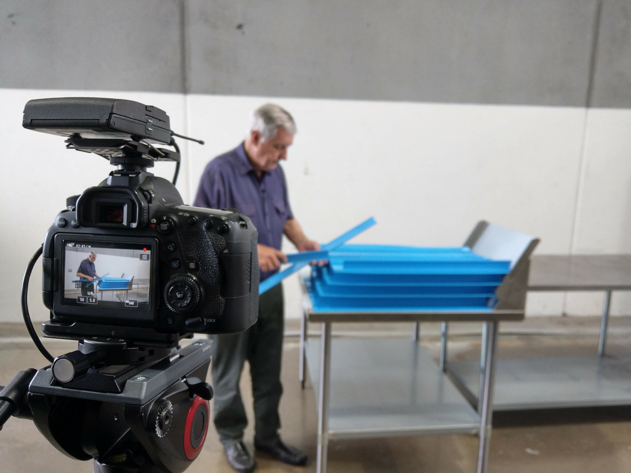 Behind the scenes of a video production in Castle Hill, Sydney. Shows video camera and man.