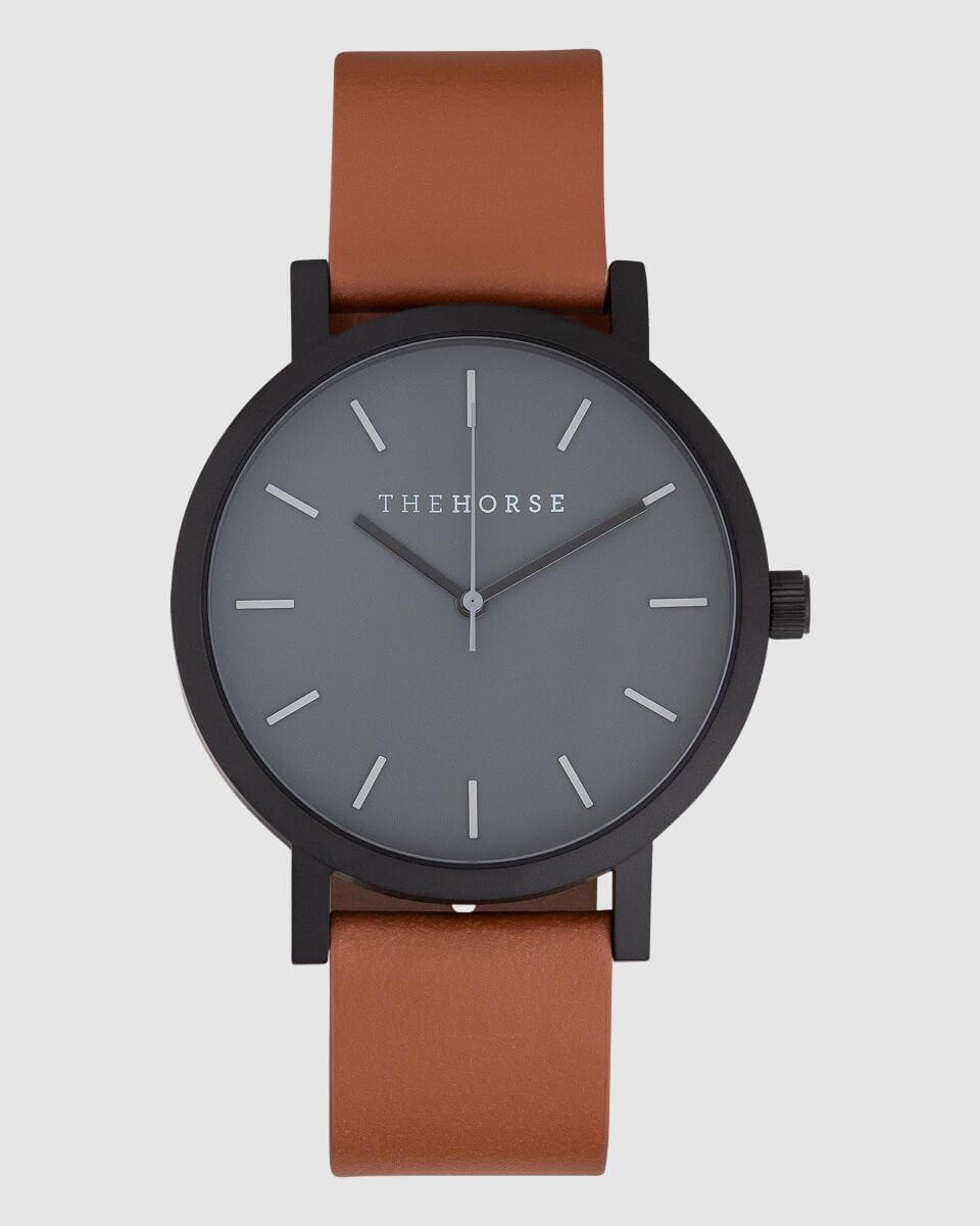 front view image of a black watch with brown strap